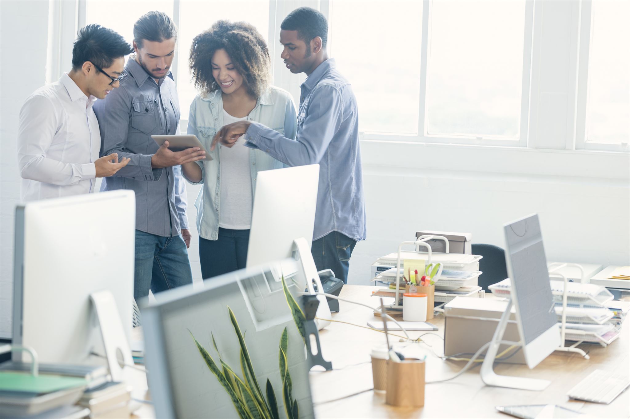 Team members collaborating in office